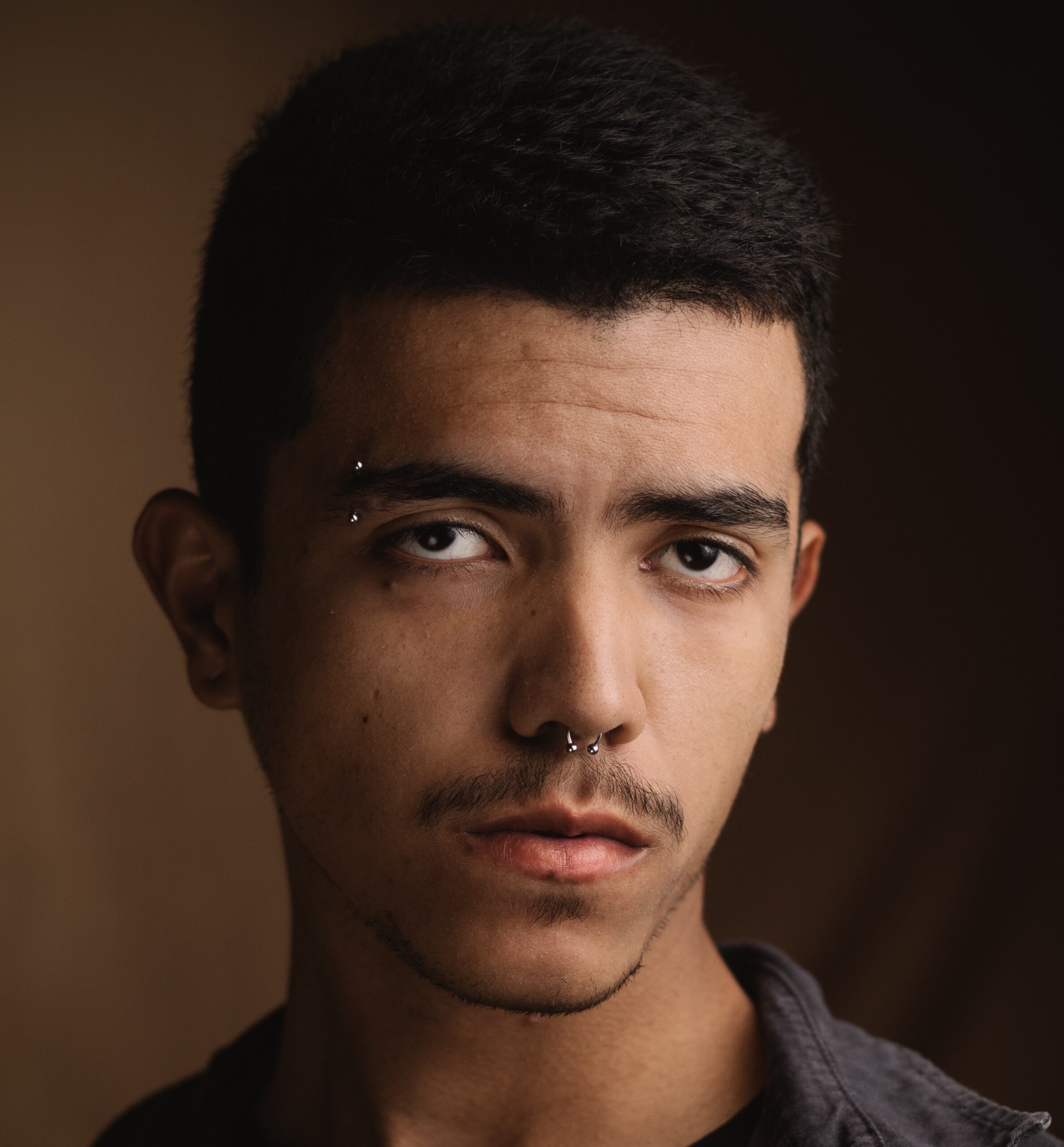 Man with eyebrow piercing