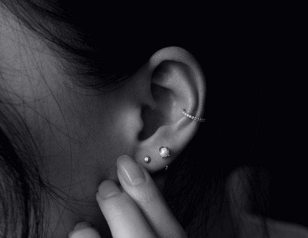 inner conch piercing with hoop